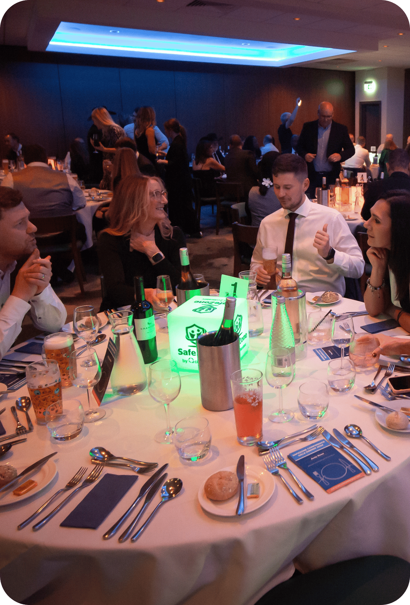 People celebrating the SafeZone Annual Conference 2024 Awards over dinner tables People celebrating the SafeZone Annual Conference 2024 Awards over dinner tables